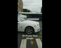 Tracy morgan drives by white convertible car 