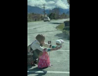 Woman holding stuffed animals kissing