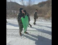 Soldier try to slide down snow fail