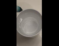 Guy sticks marker into cup of water