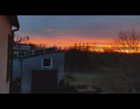 Collab DailyDoseOfInternet - View of sunset over house 