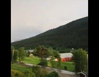 Sunrise on right rainbow thunderstorm  on left