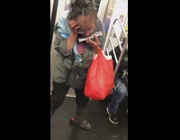Lady on subway plays harmonica for donations