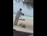 Lady lays down on beach