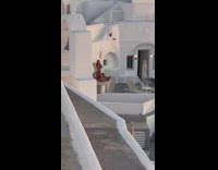 Woman in bikini takes photo of man in the pool