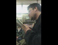 Collab Subway Creatures - a man smells the pages on book