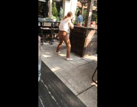 Woman white top photo shoot orange drink