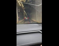 Car enter Anton Anderson Memorial tunnel rain