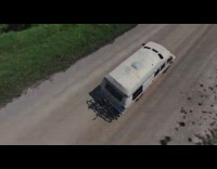 Drone follow around van on green fields