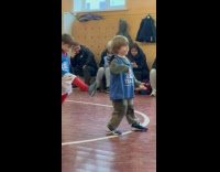 Kid poses and talks to soccer teammate