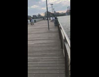 Couple dances to jazz on pier 