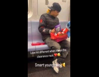 Boy prepares Valentines gift while riding subway