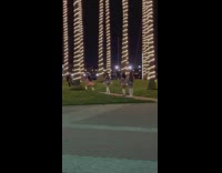 Four women in pink and blue outfit dances at the park