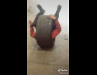 Guy wearing tire covering whole body