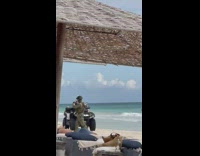 Coast guard sit on ATV beach soldier