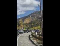 Girl upper body outside jeep sunroof traffic