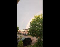 Person Pans Camera to Show Visible Double Rainbow