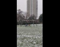 Guy underwear sit on swing snowfall park