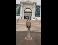 Girl poses by natural history museum