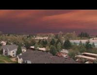 Drone red grey sky wildfires fires neighborhood 