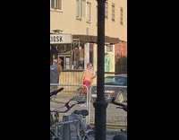 Shirtless guy red jacket walk outside selfie