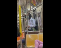 Man with suit and black paint mask