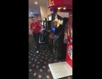 Guy red shirt kick bag fall down