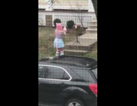 Woman pink costume cosplayer outside house