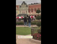 Two women jacket tiktok dance Disneyland Park