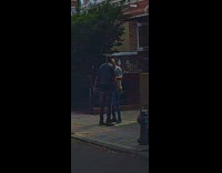 Guy fight and hit woman on sidewalk