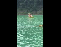 Girl pretends to paddle 