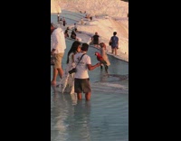 White dress girl red bird water guy