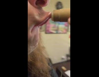 Guy puts on chapstick in slow motion on protruded lip