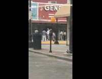 Guy tiktok dances alone sidewalk people watch 