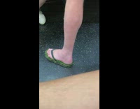 woman wears flip flops made with grass