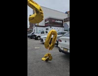 Yellow number balloons float at parking lot