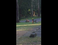 Woman bikini sit hold head on rock 
