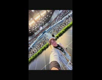 High schooler takes selfie at graduation