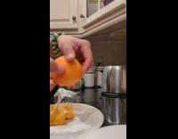 Half slice of orange pushed the inside out at the kitchen