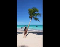 Woman on palm tree beach asks women to move