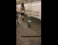 Upside down blue mickey mouse one balloon moves and floats on its own in subway station tunnel
