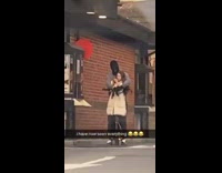 Guy with girl is wearing ski mask 