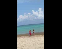 Beach tractor interrupts girls photoshoot 