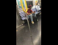Red shirt guy blasts music speaker subway 