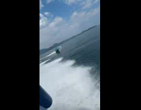 Man in tube floater flips on ocean