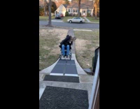 Sisters testing wheelchair ramp for mom