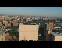 Drone shot two people on building balcony use instruments