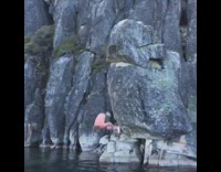 Guy backflips off rock cliff and bellyflops into water