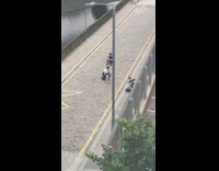 Three men photo shoot middle of alleyway