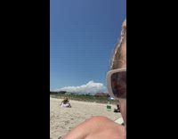 White tutu skirt girl sits beach sand